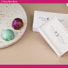 Two-piece bonbons in white boxes with 'Cocoa & Rouge' branding on a beige surface.