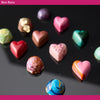 Colorful chocolate bon bons on a dark surface