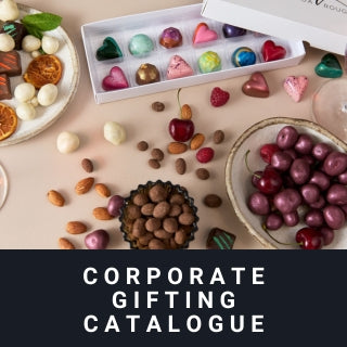 Assorted chocolates and bon bons on a table with a 'Corporate Gifting Catalogue' text overlay.