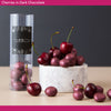 Freeze dried cherries in dark chocolate on a marble plinth