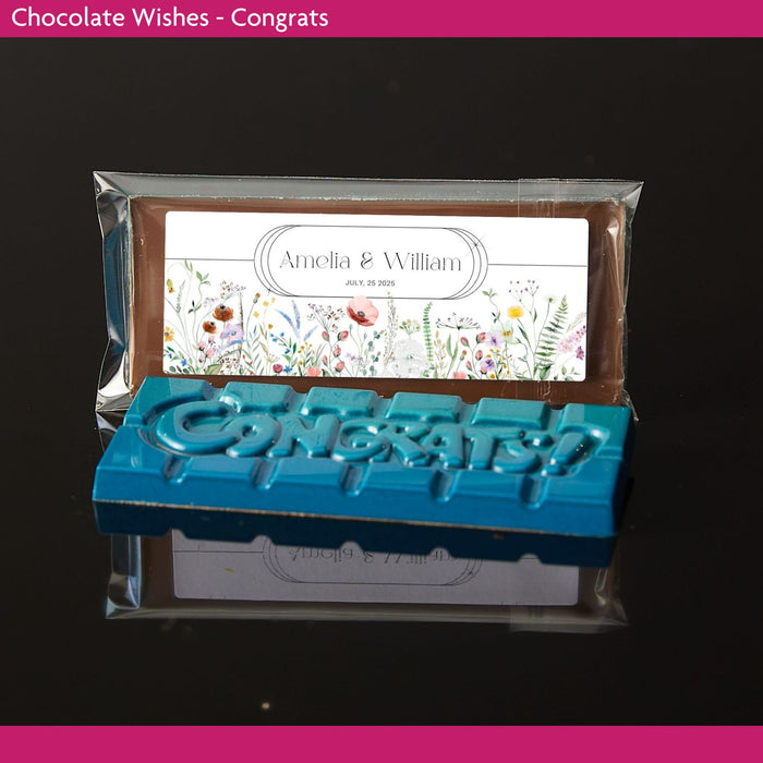 Chocolate bar with 'Congratulations' text and personalized label on a dark background