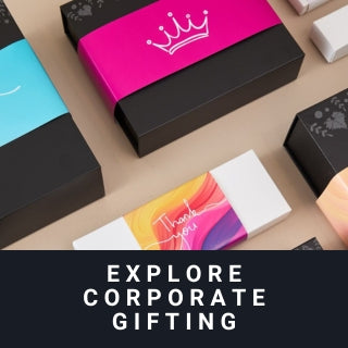 Colorful corporate gift boxes on a beige surface with text 'Explore Corporate Gifting'.