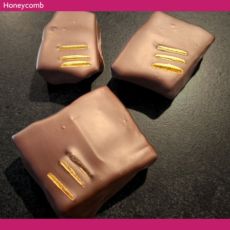 Dark chocolate covered honeycomb pieces made with buckwheat honey