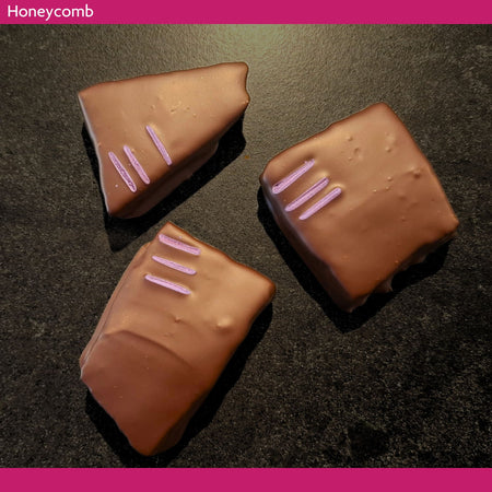 Three pieces of chocolate-covered honeycomb  made with real local honey