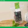 Packaged mint fudge with a green and white label on a wooden surface