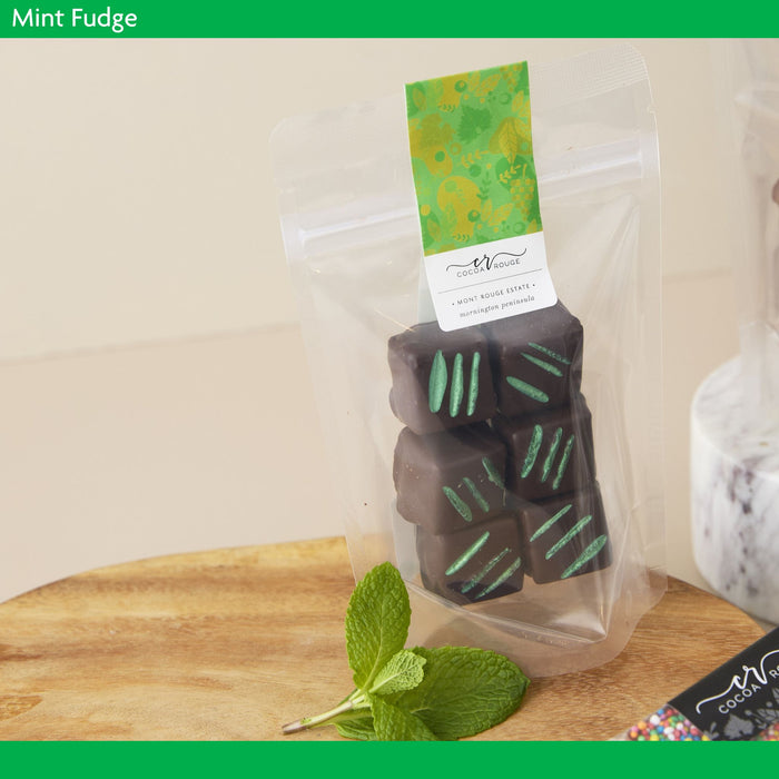Packaged mint fudge with a green and white label on a wooden surface
