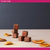 Chocolate orange fudge squares with orange slices.  Orange fudge made from fresh oranges
