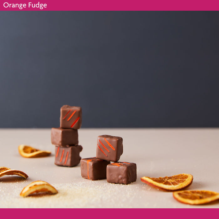 Chocolate orange fudge squares with orange slices.  Orange fudge made from fresh oranges