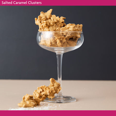 Salted Caramel Clusters in a glass on a neutral background